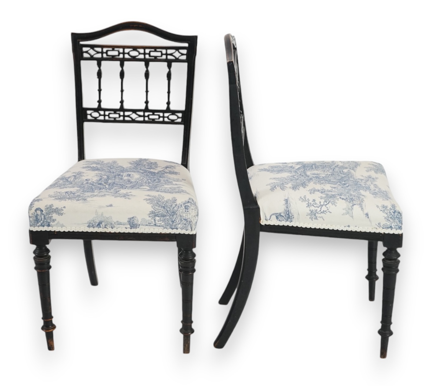 A pair of late Victorian ebonised salon chairs